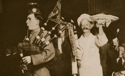 Scottish piper introduces the haggis to a Caledonian Banquet, London by English Photographer